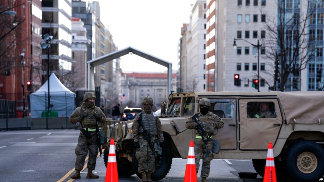 Members of the National Guard secure a checkpoint in downtown Washington, ahead of President-elect Joe Biden's inauguration ceremony, Jan. 18, 2021.