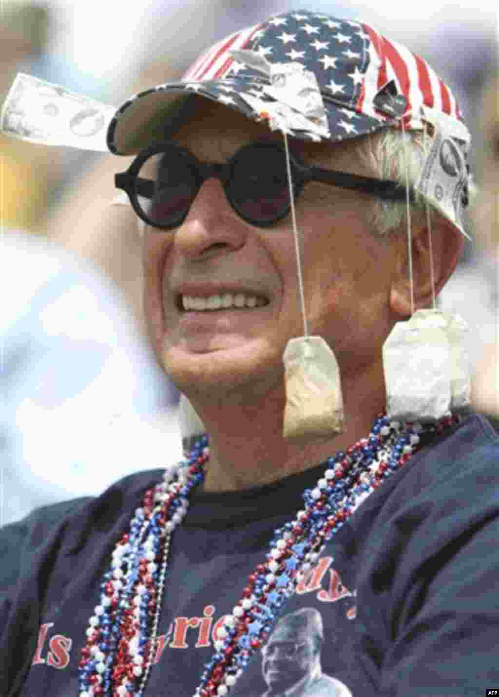 Gene Shusman listens to speakers during the 'Energy Independence Day Tea Party' rally on Independence Mall in Philadelphia, on Monday July 4, 2011. (AP Photo/ Joseph Kaczmarek)