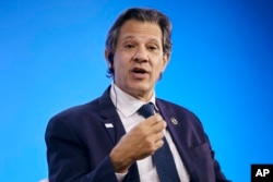 FILE — Minister of Finance of Brazil Fernando Haddad speaks during the Bloomberg Transition Finance Action Forum, September 19, 2023, in New York.