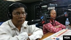 Mr. Chan Soveth, left, Department Chief of Investigation Unit of Adhoc and Mrs. Un Sophy, a representative of Lor Peang Community in Kampong Chhnang province. 