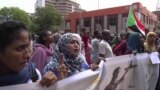 FILE - In this frame grab from video, Sudanese women rally on the streets of the capital, in Khartoum, Sudan, Sept. 12, 2019. 