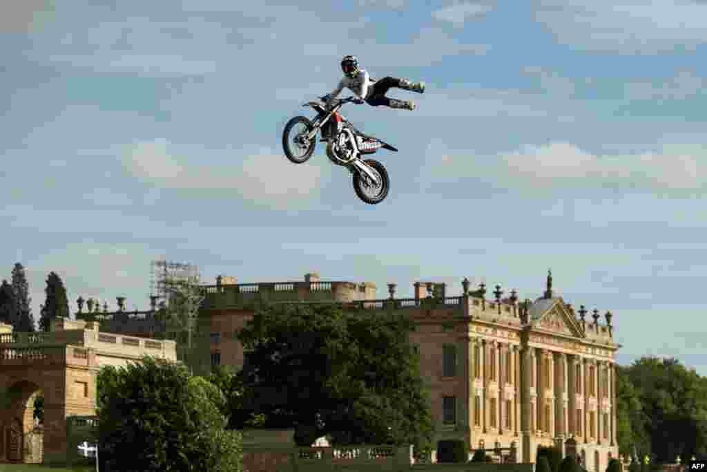 Dan Whitby of the Bolddog Lings FMX Display Team performs in the Grand Ring on the first day of the Chatsworth Country Fair in the grounds of Chatsworth House, near Bakewell in northern England. 