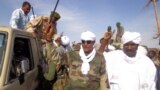 Musa Hilal (C), the leader of the Arab Mahamid tribe in Darfur, salutes his followers upon his arrival in Nyala, the capital of South Darfur state, Dec. 7, 2013.