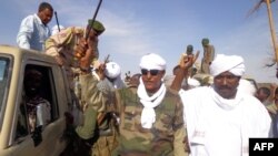 Musa Hilal (C), the leader of the Arab Mahamid tribe in Darfur, salutes his followers upon his arrival in Nyala, the capital of South Darfur state, Dec. 7, 2013.