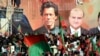 FILE - Supporters of Pakistan's jailed former Prime Minister Imran Khan rally, demanding his release from prison where he has been held for more than a year after being sentenced in multiple cases, on the outskirts of Islamabad, Sept. 8, 2024.