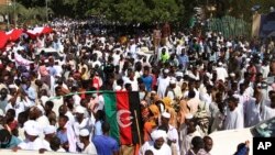 Pro-military protesters rally demanding the dissolution of Sudan's transitional government, outside the presidential palace in Khartoum, Oct. 16, 2021.