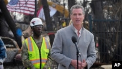 FILE - California Governor Gavin Newsom speaks during a visit to an area impacted by the Eaton Fire, in Altadena, California, Feb. 11, 2025.