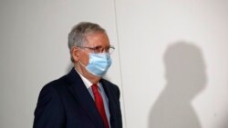 Senate Majority Leader Mitch McConnell of Ky., wears a face mask used to protect against the spread of the new coronavirus as he attends a press conference after meeting with Senate Republicans at their weekly luncheon on Capitol Hill in Washington,…