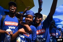 FILE - Supporters of the South African opposition party Democratic Alliance (DA) react during the DA's manifesto launch at the Union Buildings in Pretoria, on February 17, 2024.