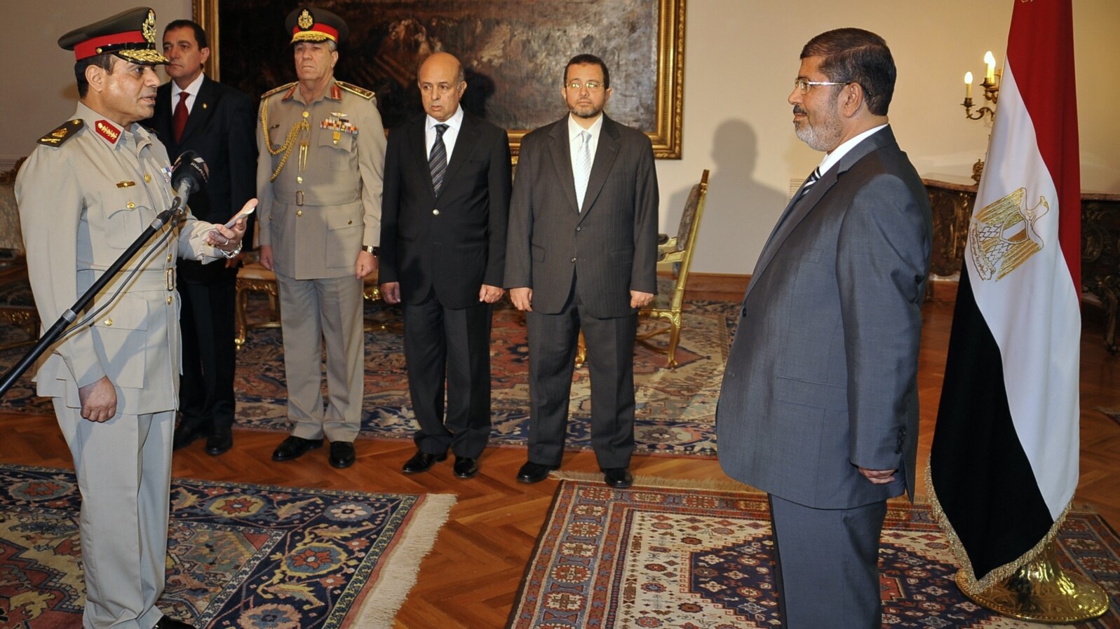 Egyptian President Mohammed Morsi swears in newly-appointed Minister of Defense, Lt. Gen. Abdel-Fattah el-Sissi, in Cairo, Egypt, Sunday, Aug. 12, 2012.
