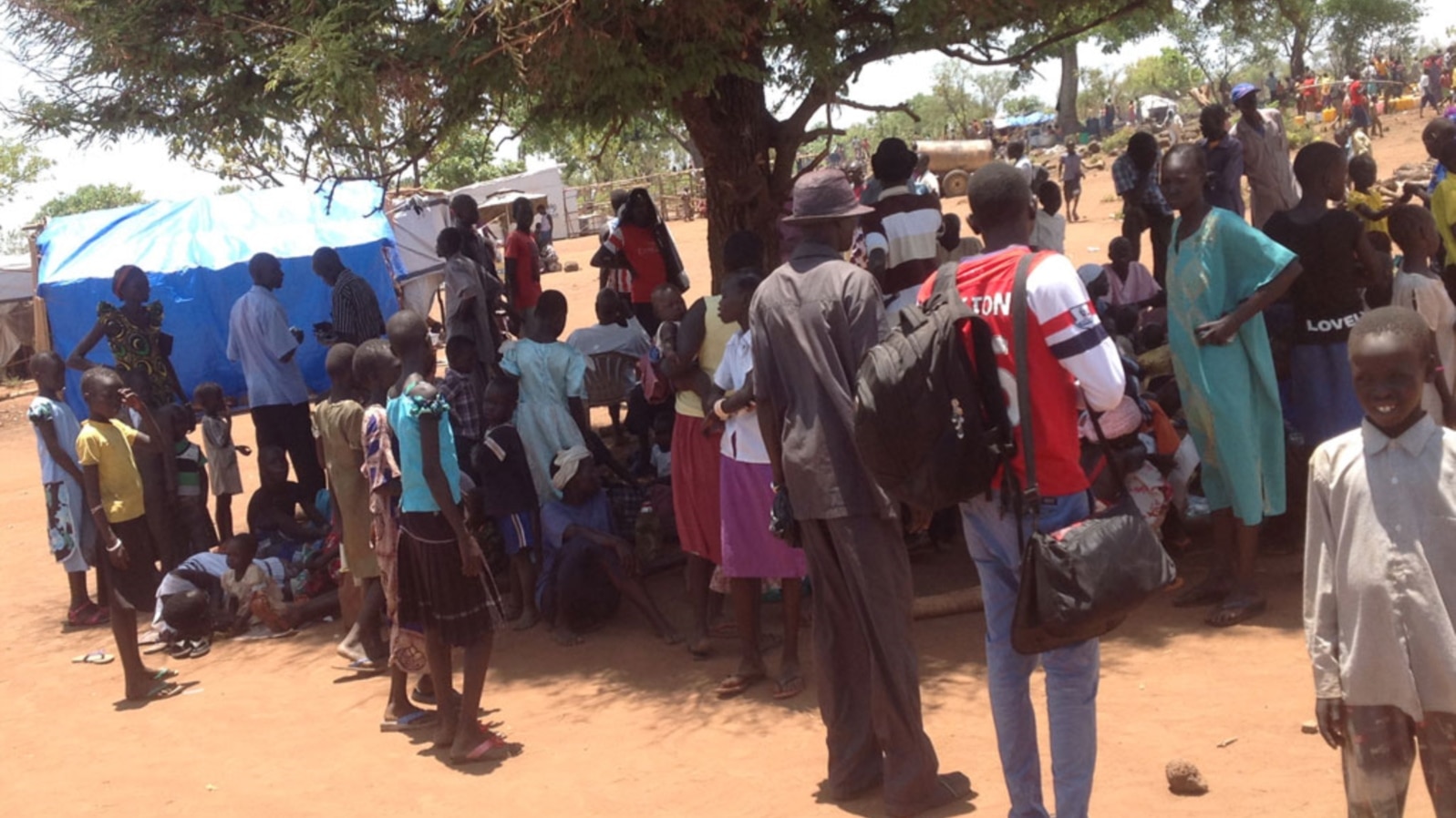 South Sudanese who fled fighting in their country wait in line to be registered as refugees in Uganda in March 2014. Some refugees in Uganda have spoken out against plans by the Juba government to hold elections in June 2015.