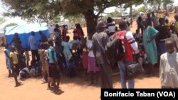 South Sudanese who fled fighting in their country wait in line to be registered as refugees in Uganda in March 2014. Some refugees in Uganda have spoken out against plans by the Juba government to hold elections in June 2015.