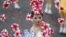 A dancer adorned with flowers performs during Taiwan's National Day celebrations in front of the Presidential Office in Taipei October 10, 2012. 