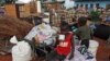 Zimbabwean children sit among salvaged possessions at a transit camp for over 100 families displaced by floods near the Tokwe-Mukorsi dam about 430km (267 miles) south of Harare, Feb. 13, 2014.