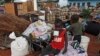 Zimbabwean children sit among salvaged possessions at a transit camp for over 100 families displaced by floods near the Tokwe-Mukorsi dam about 430km (267 miles) south of Harare, Feb. 13, 2014.