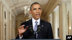 President Barack Obama addresses the nation in a live televised speech from the East Room of the White House in Washington, Tuesday, Sept. 10, 2013. 