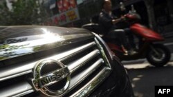 Japanese auto giants Nissan and Toyota said they would cut production in China because demand for Japanese cars has been hit by the diplomatic bitter row over disputed islands, Sept. 26, 2012.. 