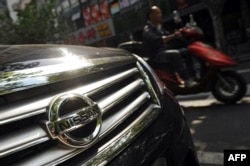 FILE - Japanese auto giants Nissan and Toyota said they would cut production in China because demand for Japanese cars has been hit by the diplomatic bitter row over disputed islands, Sept. 26, 2012..