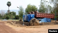Trucks are seen in the compound of the Cambodia Iron Group at the Rovieng District in Preah Vihear province, February 10, 2013.
