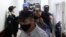 Ivan Safronov, a former journalist who works as an aide to the head of Russia's space agency Roscosmos, detained on suspicion of treason is escorted before a court hearing in Moscow, Russia, July 7, 2020. 