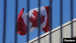 The Canadian national flag flies above the Canadian embassy in Beijing, China, Jan. 15, 2019. 
