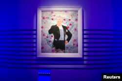 The artwork "De la rue aux etoiles, Jean Paul Gaultier, 2014" by artists Pierre et Gilles is seen during the press visit of the Jean Paul Gaultier Exhibition at the Grand Palais, March 30, 2015.