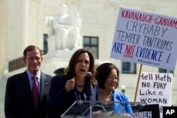 From left, Sen. Richard Blumenthal, D-Conn., Sen. Kamala Harris, D-Calif., Sen. Mazie Hirono, D-Hawaii, speak as protesters rally against Supreme Court nominee Brett Kavanaugh as the Senate Judiciary Committee debates his confirmation, Sept. 28, 2018.