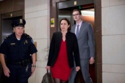 Former White House advisor on Russia, Fiona Hill, arrives on Capitol Hill in Washington, Oct. 14, 2019, as she is scheduled to testify before congressional lawmakers as part of the House impeachment inquiry into President Donald Trump.