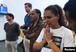 Hiwet Tesfamarian, sister of Medhane Tesfamariam Berhe, reacts after hearing the verdict in the case of an alleged people-smuggling kingpin identified by the court as Medhanie Yehdego Mered, who claims his identity has been mistaken, Palermo, Italy.