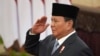 Indonesian President Prabowo Subianto salutes during the swearing-in ceremony of the new cabinet ministers at the presidential palace in Jakarta, Indonesia, Oct. 21, 2024.