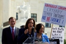 FILE - Sen. Richard Blumenthal, D-Conn., Sen. Kamala Harris, D-Calif., and Sen. Mazie Hirono, D-Hawaii, speak as protesters rally against Supreme Court nominee Brett Kavanaugh, Sept. 28, 2018, at the Supreme Court in Washington.