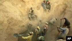 FILE - Miners dig for diamonds in Marange, eastern Zimbabwe. 