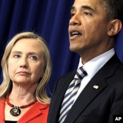 FILE - U.S. President Barack Obama announces that then-Secretary of State Hillary Clinton will travel to Burma, Nov. 18, 2011.