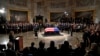 Vice President Kamala Harris, left, delivers a eulogy for former President Jimmy Carter as he lies in state during a ceremony in the Capitol, Jan. 7, 2025, in Washington. Carter died Dec. 29 at the age of 100. 