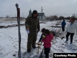 Members of the Crow Creek Reservation in Fort Thompson, S.D., planting their first community orchard in Spring 2012. Photo courtesy of Crow Creek Fresh Food Initiative