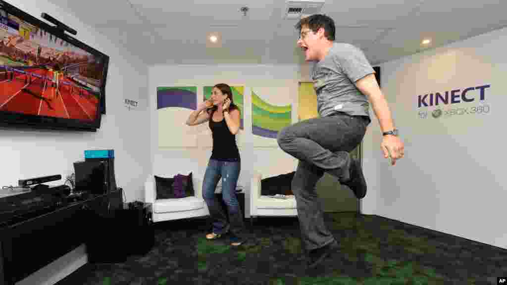 In this photograph taken by AP Images for Xbox, Actor Rich Sommer plays Kinect on Xbox 360 at the Xbox booth during the E3 2010 conference held at the Los Angeles Convention Center in Los Angeles on June 15, 2010. 