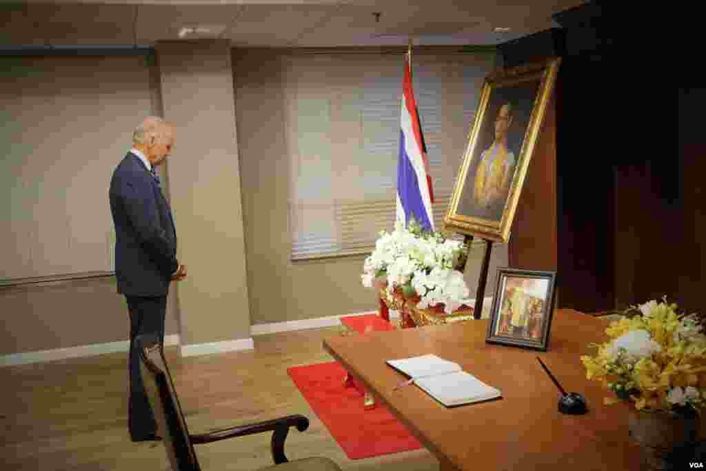 Vice President Joe Biden signs a book of condolences for His Majesty King Bhumibol Adulyadej