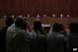 Judges sit in the Superior Electoral Court during the judgment phase of a trial involving allegations that the 2014 Rousseff-Temer ticket received illegal campaign financing in Brasilia, Brazil, June 6, 2017.