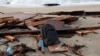 A view of the wreckage of a shipwreck in southern Italy which has left dozens of migrants dead after the boat in which they were travelling smashed onto the rocks, in Cutro, Italy, Feb. 27, 2023. 