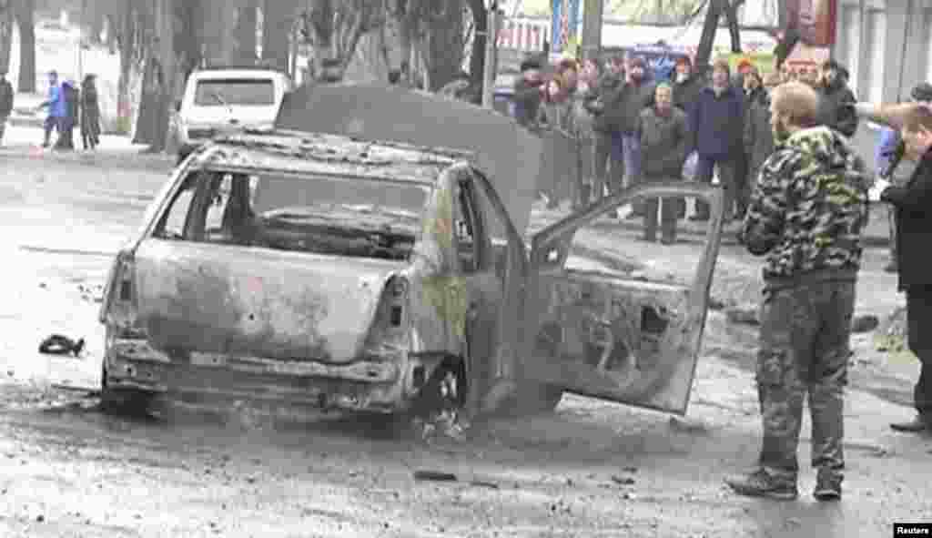 This still image captured from video footage shows a burned-out car destroyed by shelling in Donetsk, Jan. 22, 2015.