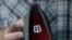 Betabrand CEO Chris Lindland holds up a shoe while being interviewed at a Betabrand store in San Francisco, Feb. 15, 2018.