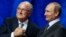 FIFA's President Sepp Blatter shakes hands with Russia's President Vladimir Putin (R) during the preliminary draw for the 2018 FIFA World Cup at Konstantin Palace in St. Petersburg, July 25, 2015.