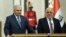Iraq's Prime Minister Haider al-Abadi, right, and Turkish Prime Minister Binali Yildirim speak to reporters after their talk in Baghdad, Iraq,, Jan. 7, 2017. 