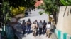 Security forces investigate the perimeters of the residence of Haitian President Jovenel Moise, in Port-au-Prince, Haiti, July 7, 2021. Gunmen assassinated Moise and wounded his wife in their home early Wednesday. 