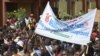 People march during an opposition protest in Ouagadougou on July 28, 2013 against the creation of a Senate which they say will enable the President to extend his 26-year rule. 