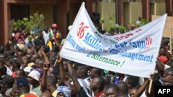 People march during an opposition protest in Ouagadougou on July 28, 2013 against the creation of a Senate which they say will enable the President to extend his 26-year rule. 