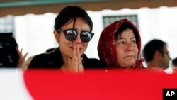 Family members and friends attend the funeral prayer for Gulsen Bahadir, 28, a Turkish Airlines (THY) flight attendant killed Tuesday at the blasts at Ataturk airport, in Istanbul, June 29, 2016. 