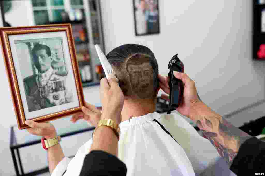 Mitree Chitinunda gets a haircut in the shape of Thai King Maha Vajiralongkorn, to mark King&#39;s 67th birthday, in a barbershop at Bangkok, Thailand.