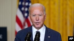 President Joe Biden participates in a virtual event with the Munich Security Conference, in the East Room of the White House, in Washington, Feb. 19, 2021. 