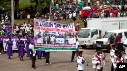 Kenyan workers march during the Labour Day Celebration Parade at Uhuru Park, Nairobi, Kenya, Monday, May 1, 2017. Large crowds gathered in Uhuru Park Monday to mark the International Labour Day. (AP Photo/Sayyid Abdul Azim)